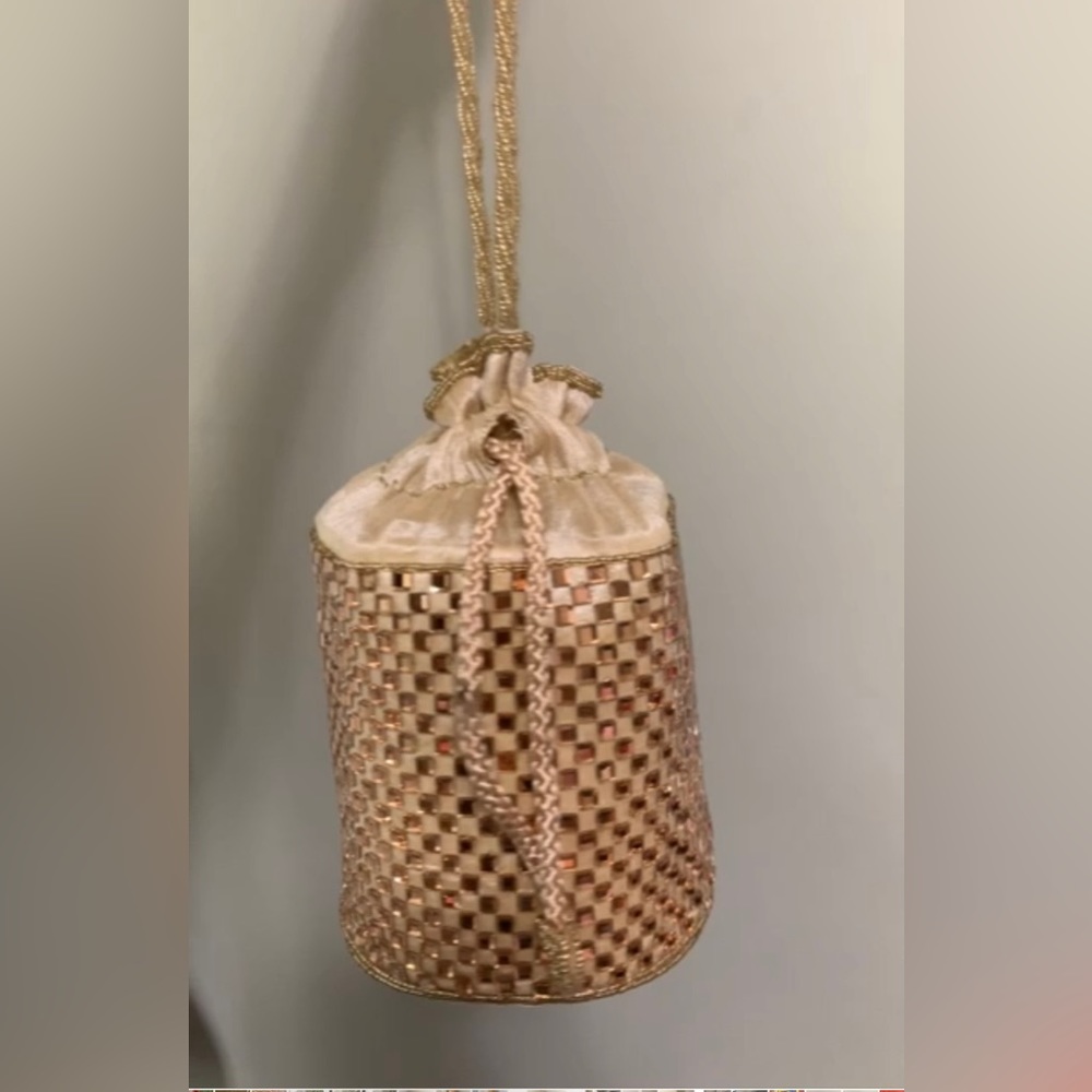 Golden bag ( clutch, potli )
